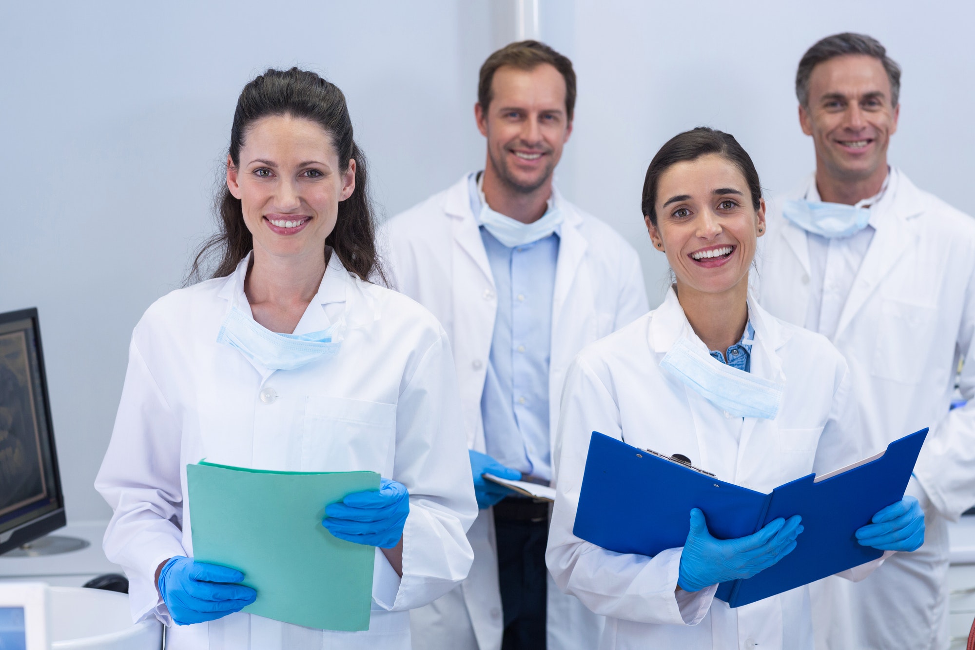 smiling-dentists-standing-in-dental-clinic.jpg